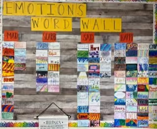 Photo of an "Emotions Word Wall" displaying students work about emotions.